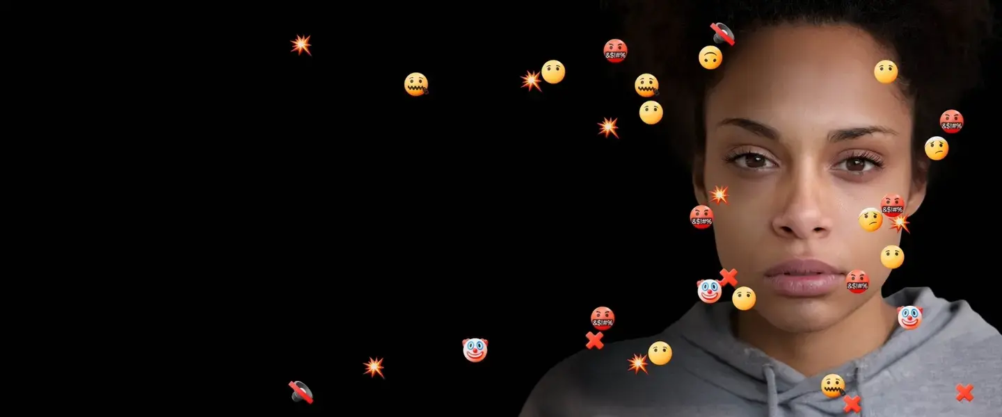 A woman surrounded by hateful emojis looks at the camera. Photo:UN Women