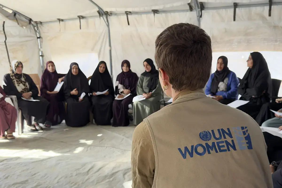 The“Smile of Hope" is run by AISHA, a UN Women partner and women-led-organization that provides, among other services, case management and protection support for displaced female cancer patients. Pictured:  Isadora de Moura, head of the UN Women Gaza sub-office (in vest) listens to participants after a mental health and psychosocial support group session.  Photo: UN Women/Sulaiman Hejji