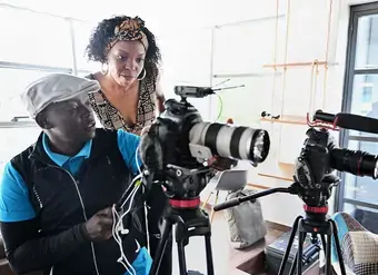 Adelle Onyango (in brown) interacts with a guest during a shoot for her Legally Clueless podcast in Nairobi. 